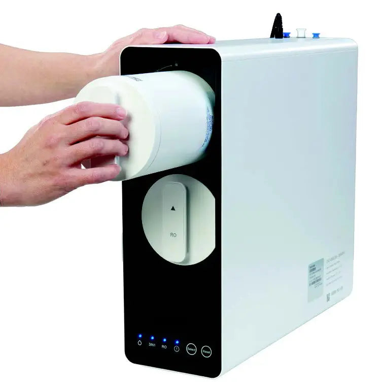 Hand using a paper towel from a dispenser on a white background